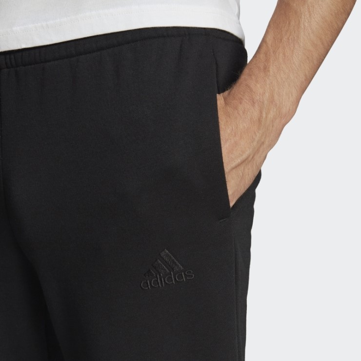 Adidas Essentials - Pantalones De Forro Polar Con Logo En Los Puños Cónicos, Color Negro